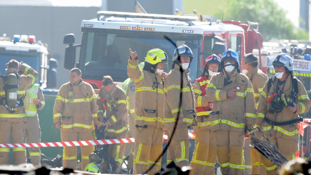 Fire crew at the scene where a light plane crashed