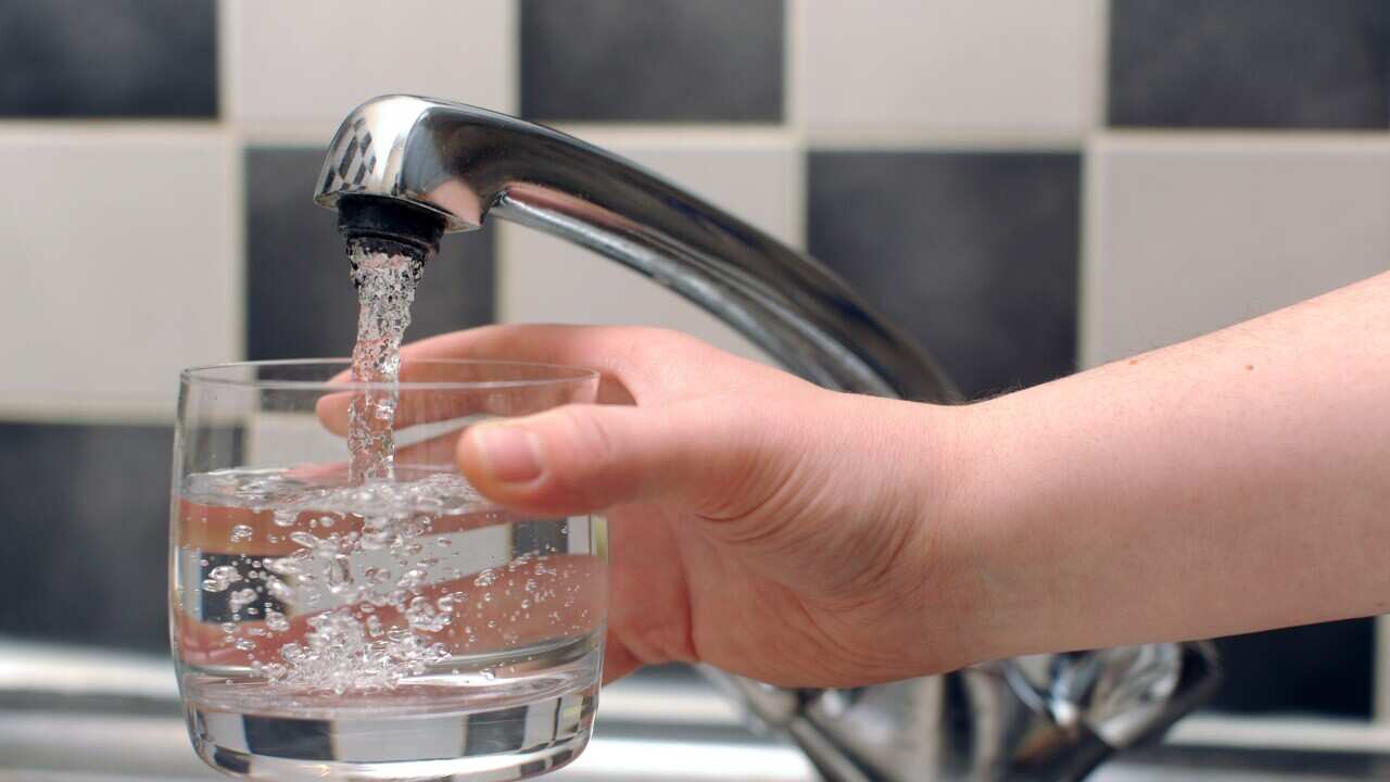Australians reassured fluoride in drinking water is effective and safe, but final review pending