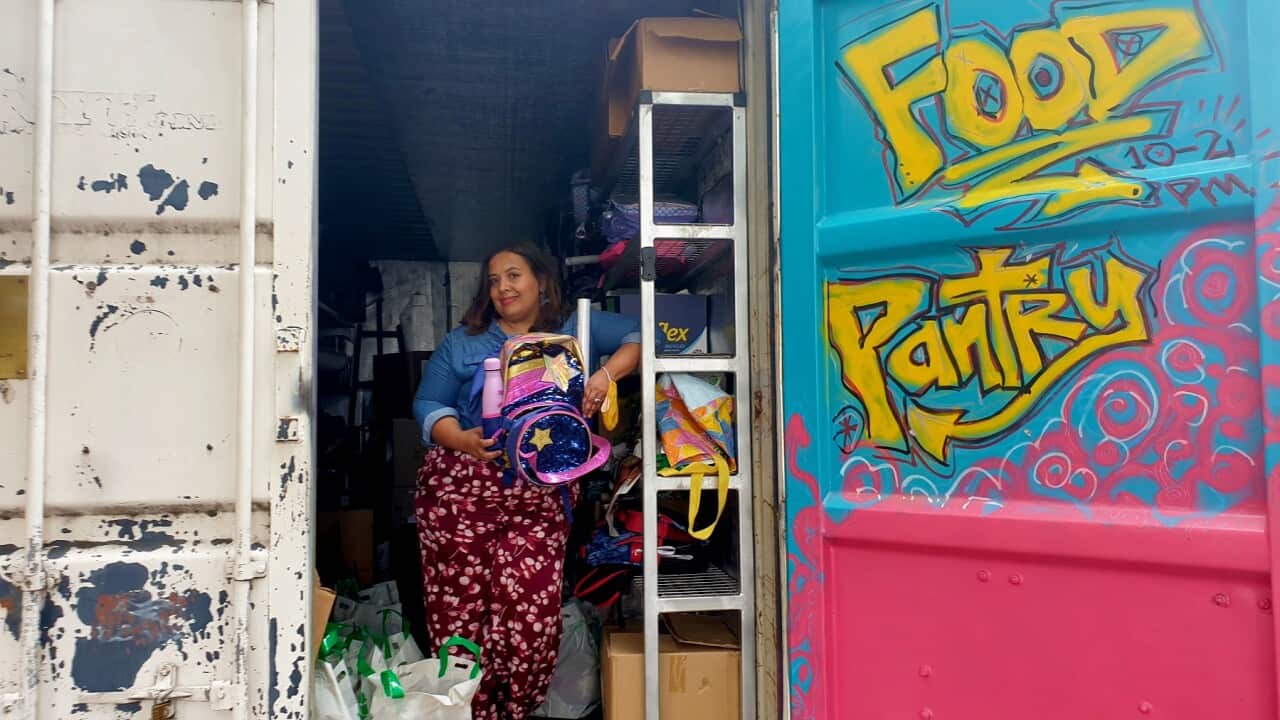 Dulce Muñoz with one of the backpacks donated by Sydney mums