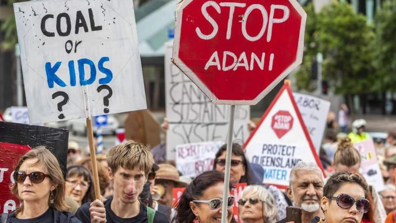 Students protest outside the Adani Headquarters in Brisbane.