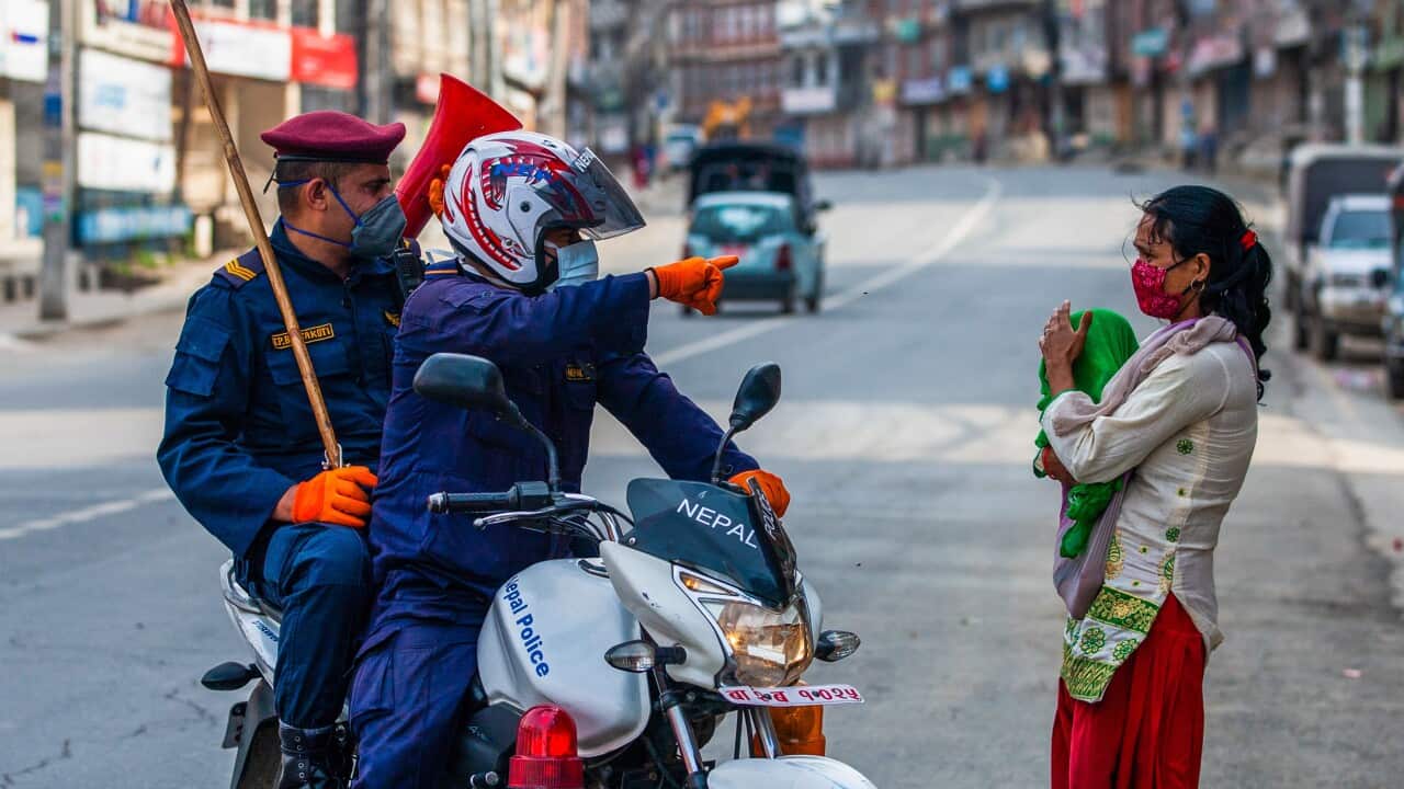 Police officers patrol the street during the coronavirus crisis in Kathmandu Nepal.