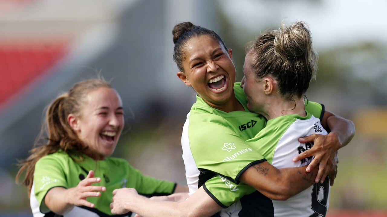 Former A-League Women's player, Allira Toby celebrates with her teammates during a football game in 2022.