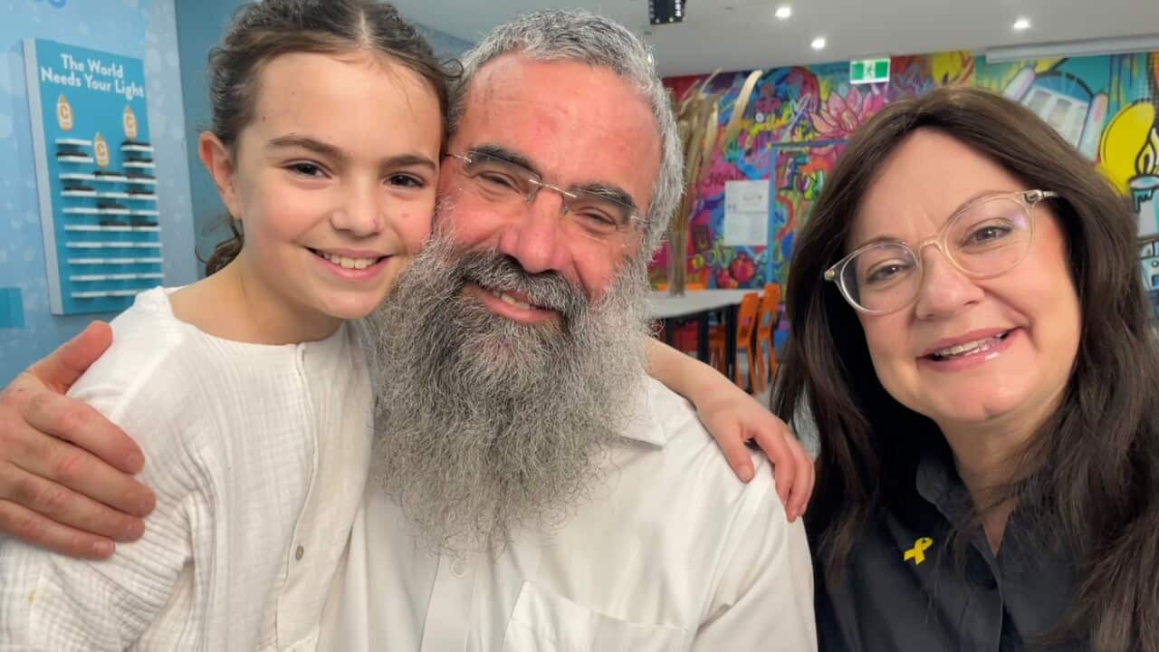 Rabbi Slavin (centre) with his wife Laya (right) and daughter Rivka (SBS-Sandra Fulloon).jpg