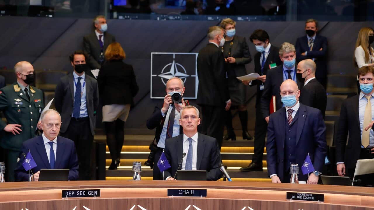 NATO Secretary General Jens Stoltenberg (c) at the start of an extraordinary virtual summit of NATO heads of state on 25 February, 2022