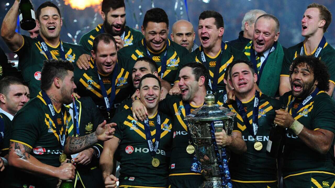 Australian rugby league players celebrate winning the 2013 World Cup