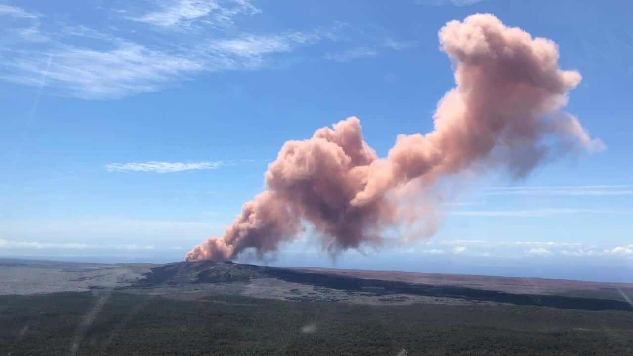 In this photo provided by the U.S. Geological Survey, red ash rises from the Puu Oo vent on Hawaii's Kilauea Volcano 