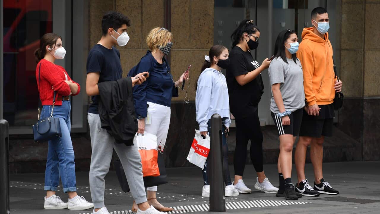 People wearing facemasks in the Sydney CBD in December 2020.  
