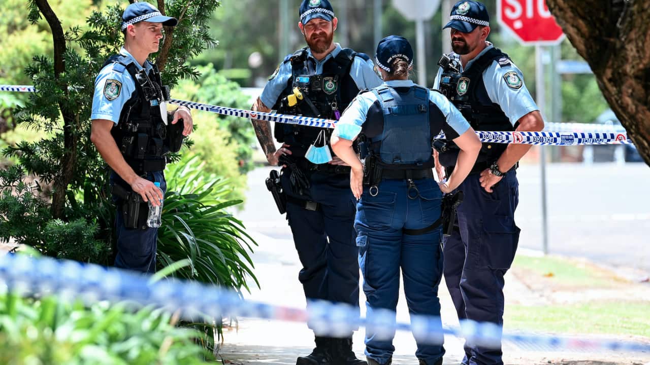NSW Police officers at the scene where a woman was found dead inside an apartment at North Parramatta, Sydney, 31 January, 2022.