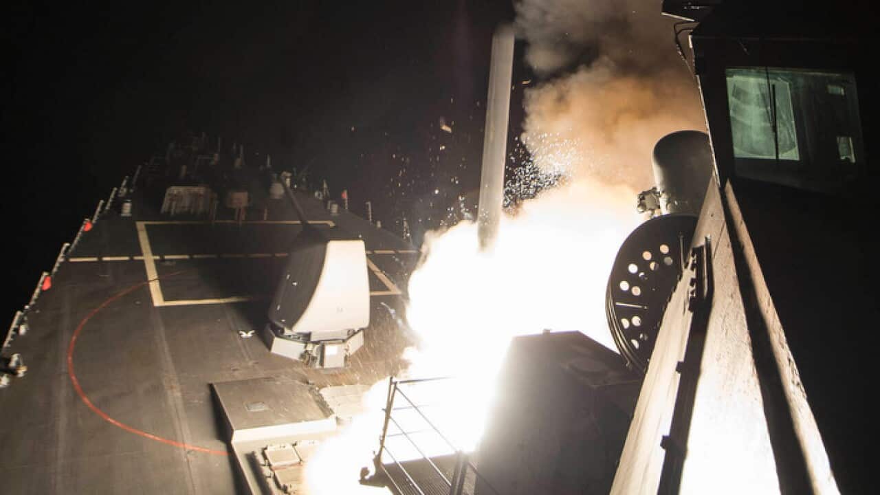 USS Ross fires a tomahawk land attack missile from Mediterranian sea