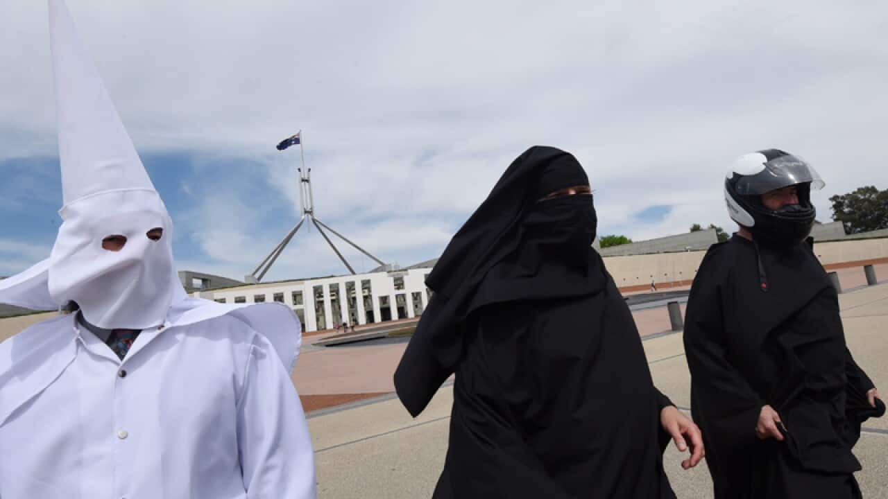 Protesters wearing face coverings
