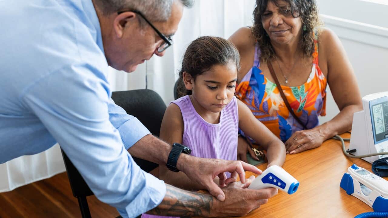 Young Aboriginal girl gets a check up at the doctor’s surgery