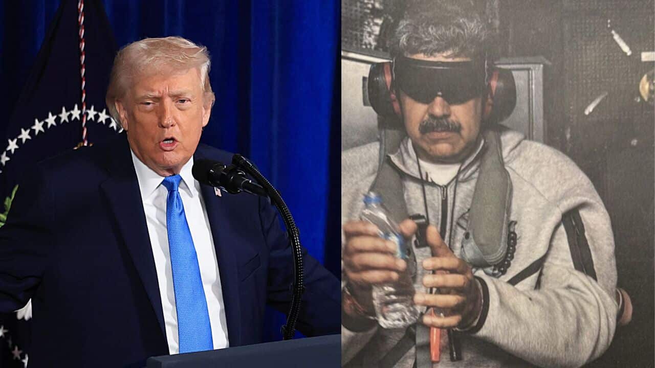 A man in custody and a man in a suit