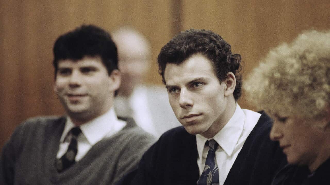 Erik and Lyle Menendez in a courtroom wearing shirts, ties and cardigans