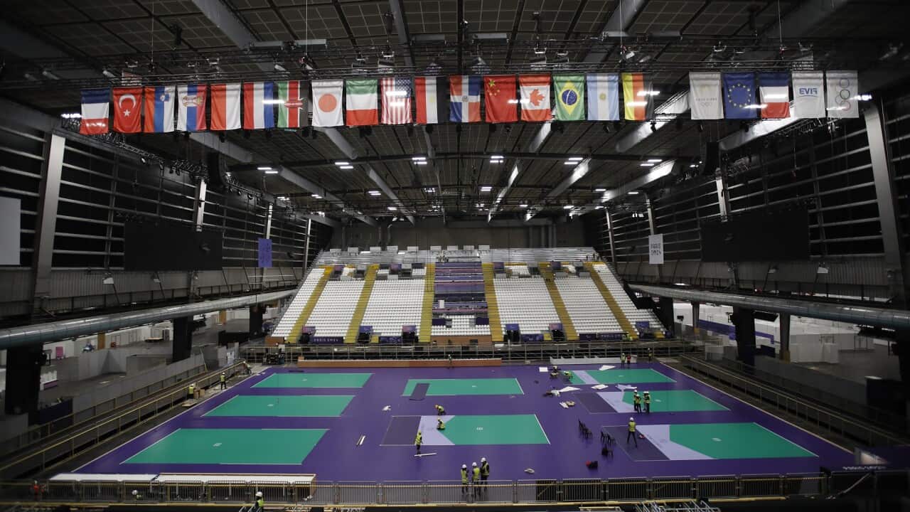 Workers prepare the Boccia pitch during a visit of the Arena Paris Sud venue.