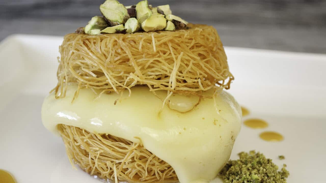 Cheesy pastry in rosewater syrup