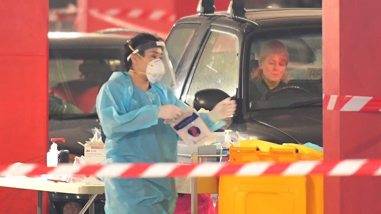Healthcare employees are seen at work in a Covid-19 testing facility at Northland shopping centre in Melbourne, Monday, 22 June, 2020. 