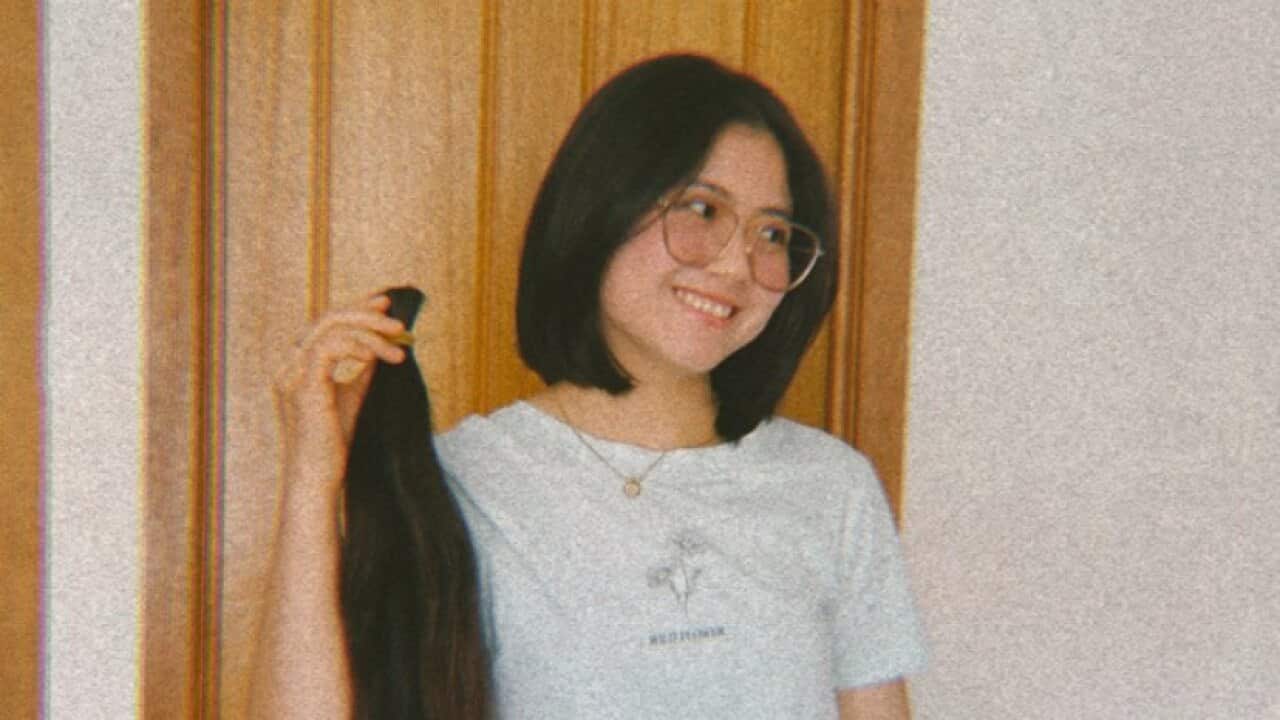 Sianger cut her hair for donation.jpg