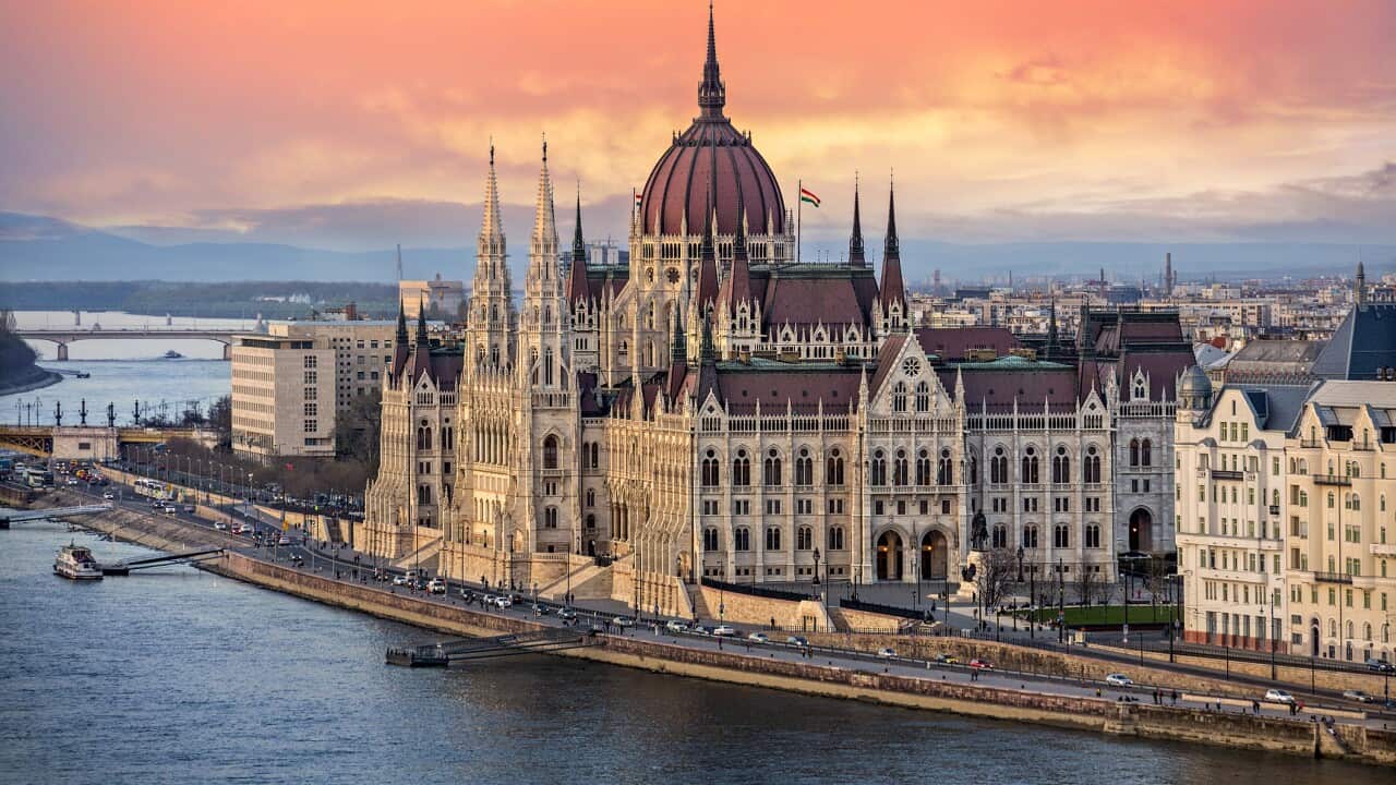 The Hungarian Parliament on the Danube River at Sunset in Budapest, Hungary