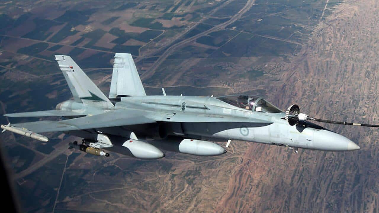 A RAAF F/A-18A Hornet aircraft air to air during a mission in the Middle East Region.