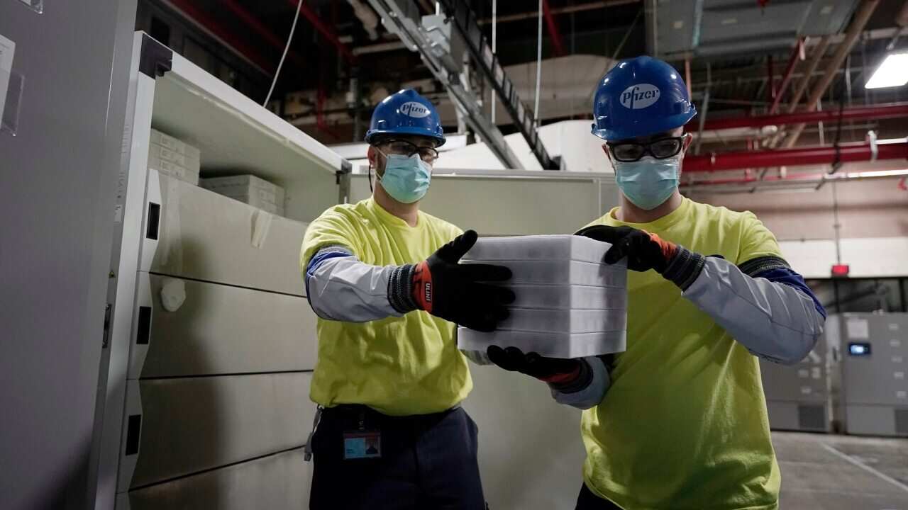 Boxes containing the Pfizer-BioNTech COVID-19 vaccine are prepared to be shipped