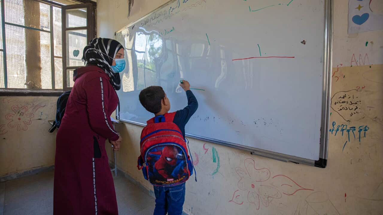 A seven-year-old attends class