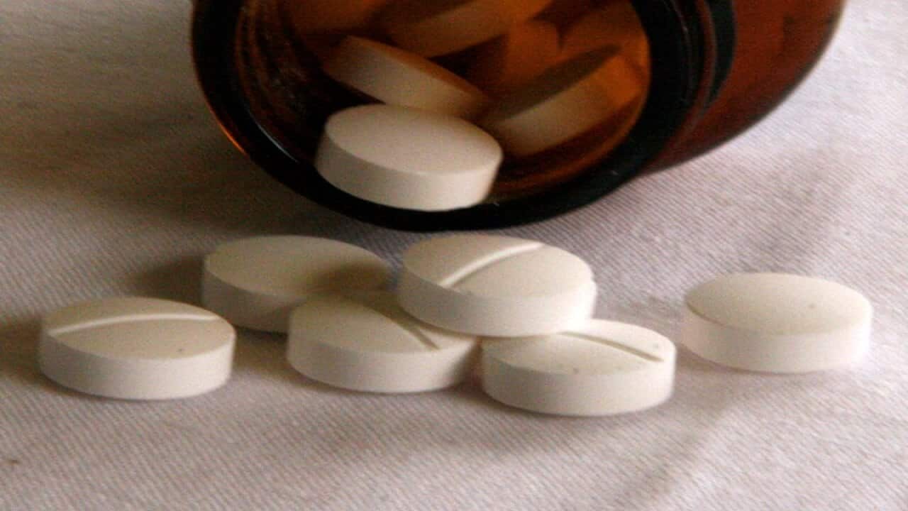 Tablets fall from a jar