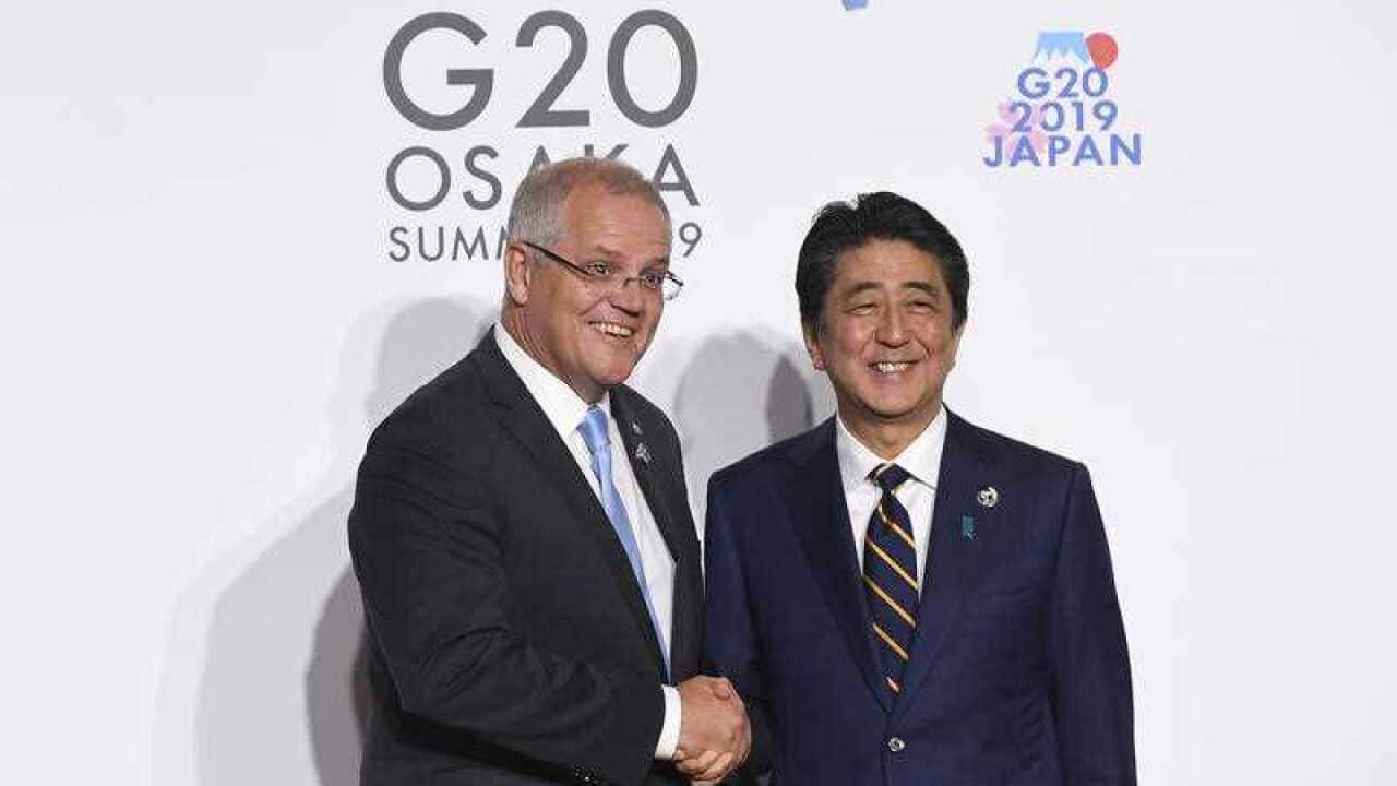 Prime Minister Scott Morrison shakes hands with Prime Minister of Japan Shinzo Abe