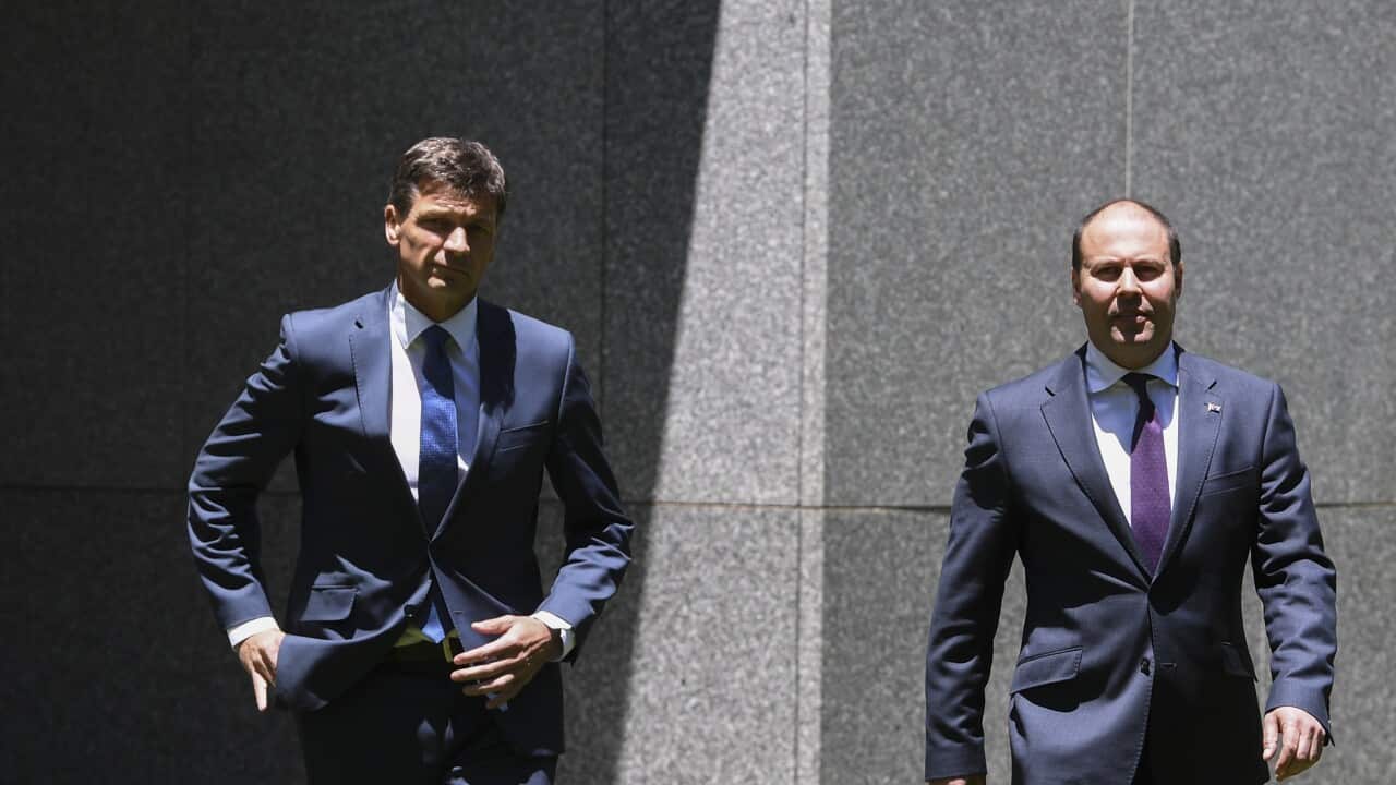 Australian Federal Treasurer Josh Frydenberg (right) and Australian Energy Minister Angus Taylor arrive to speak to the media during a press conference