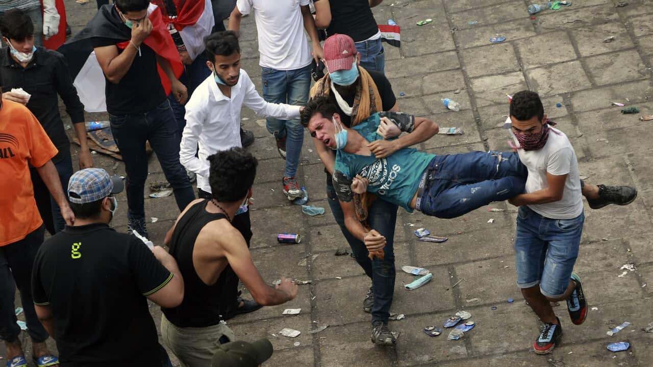 An injured protester is rushed to a hospital during a demonstration in Baghdad, Iraq.