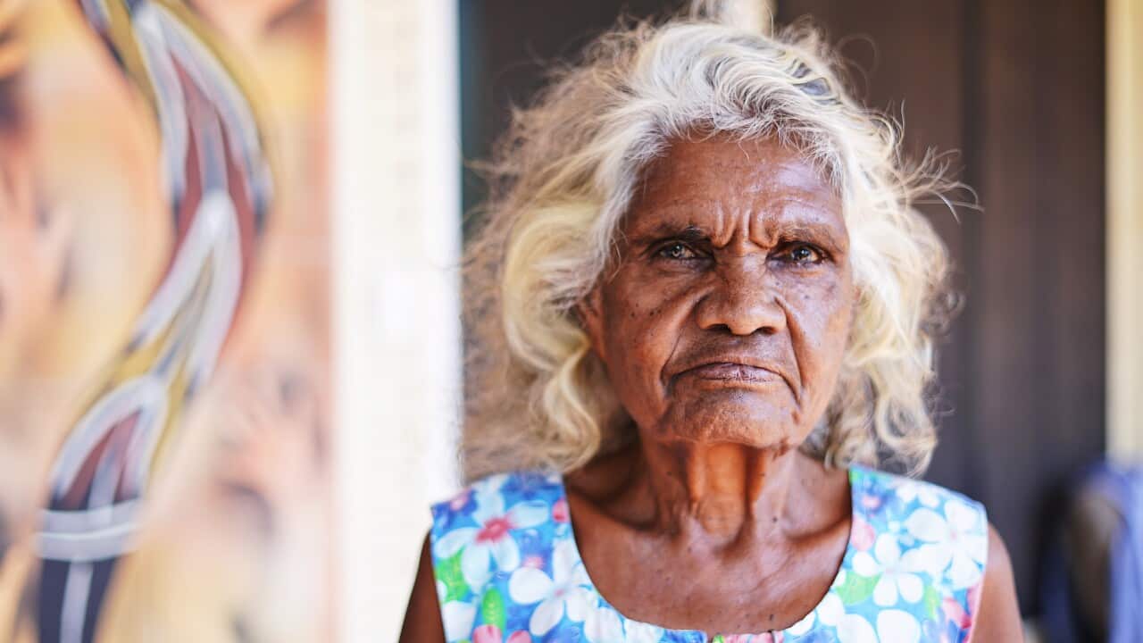 Helen Fejo-Frith poses in front of her home in Bagot