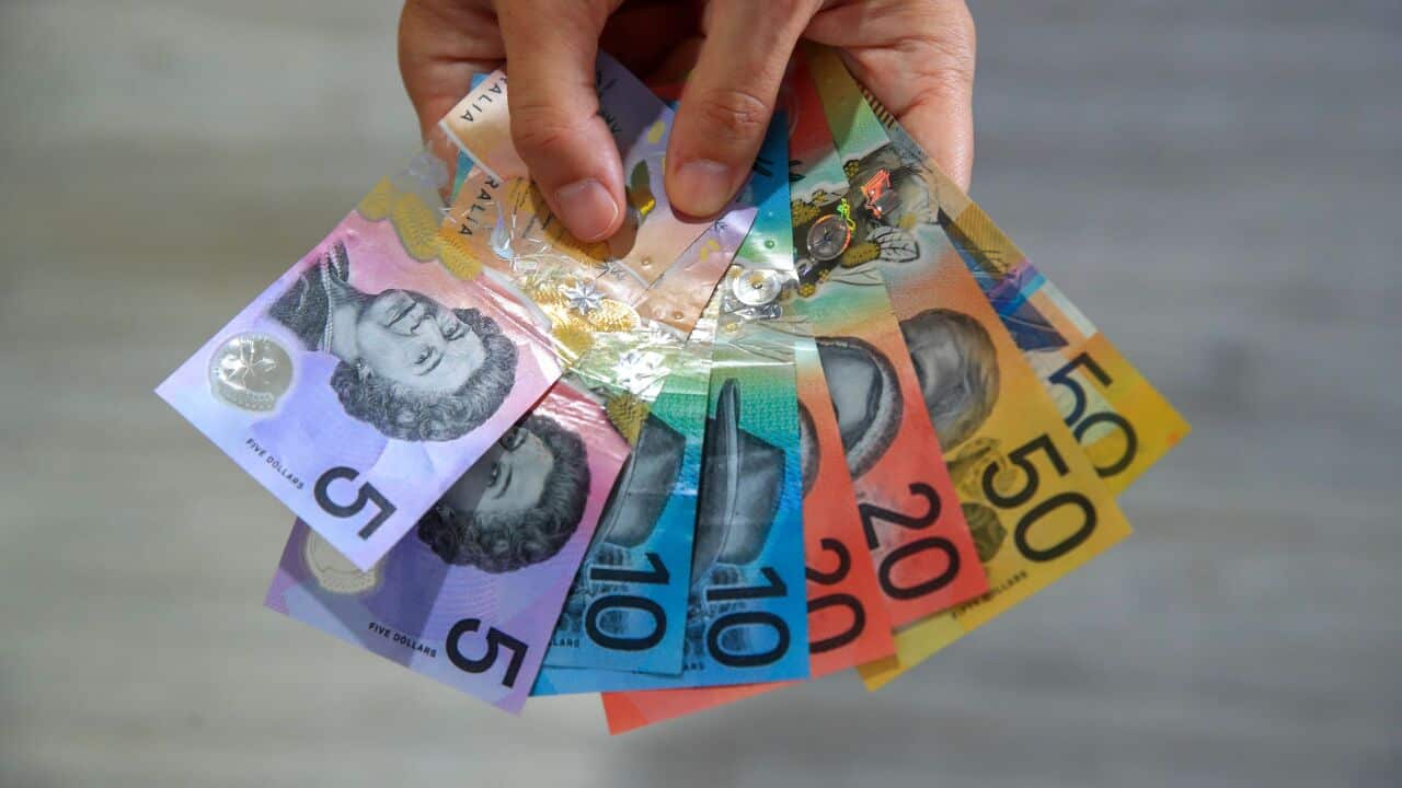 Australian bank notes held in a hand