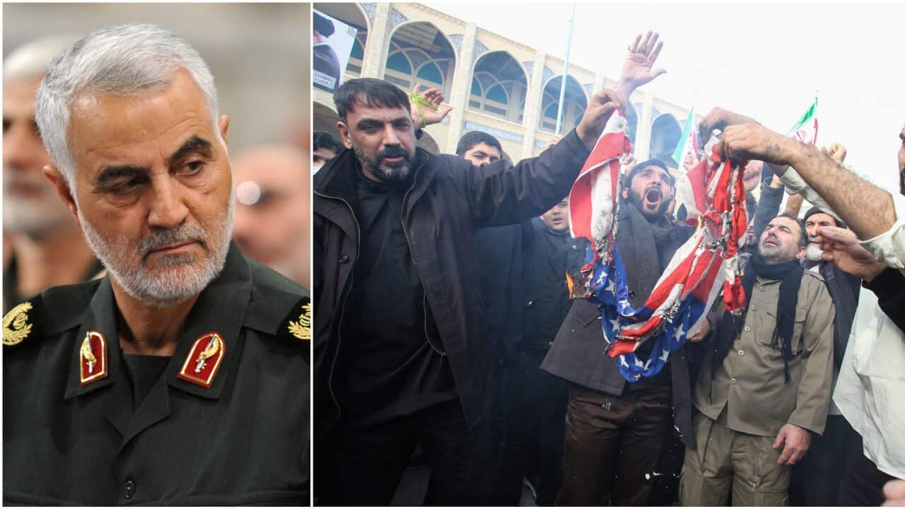 Iranians burn a US flag during a demonstration following the killing of Iranian Revolutionary Guard's Major General Qasem Soleimani.