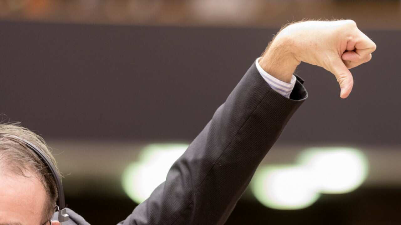 A Member of the European Parliament votes during a session on Brexit.