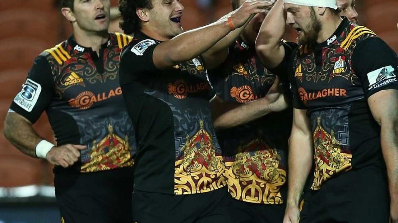 Chiefs players congratulates Mitchell Brown after a try