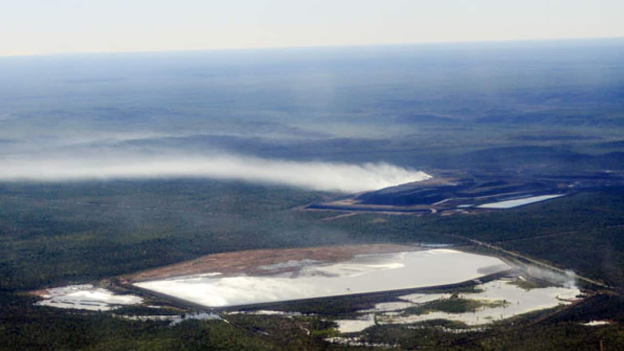 Clouds of sulphur dioxide being emitted from the gigantic waste rock pile at McArthur River Mine 2014. David Morris EDONT
