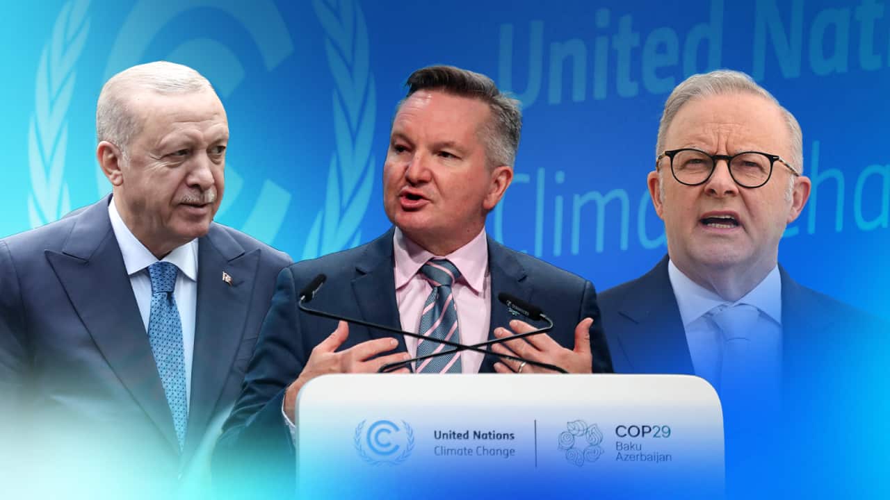 A stylised image of three men in suits featuring a blue background with the words "United Nations Climate Change" written on it next to a UN logo.