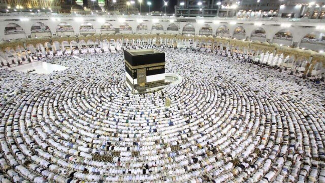 Muslim worshipers perform the evening (Isha) prayers at the Kaaba, Islam's holiest shrine, at the Grand Mosque in Saudi Arabia's holy city of Mecca