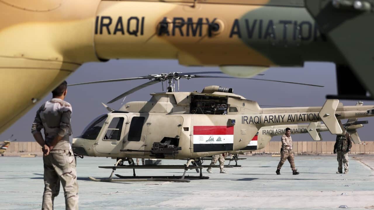File image of an Iraqi airforce Bell 407 helicopter is seen parked at the army base of Qaryat Jaddalat