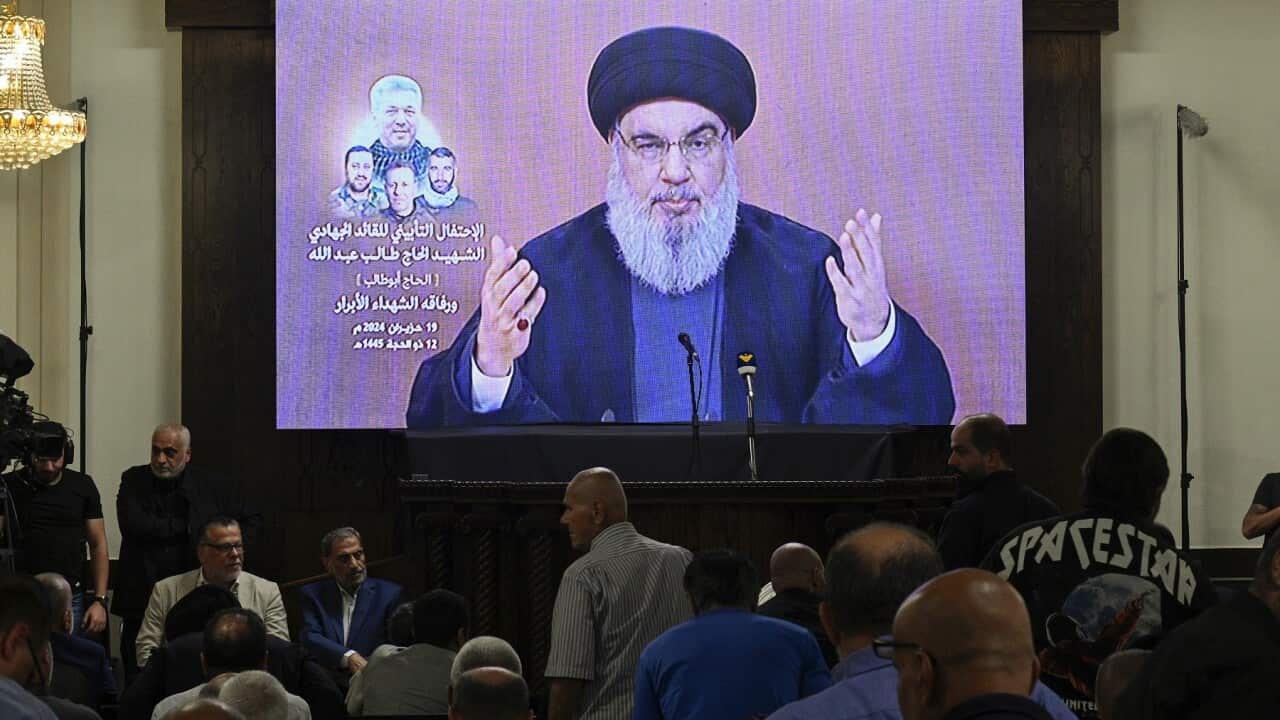 Hezbollah leader Hassan Nasrallah delivers a speech via a screen (AAP)