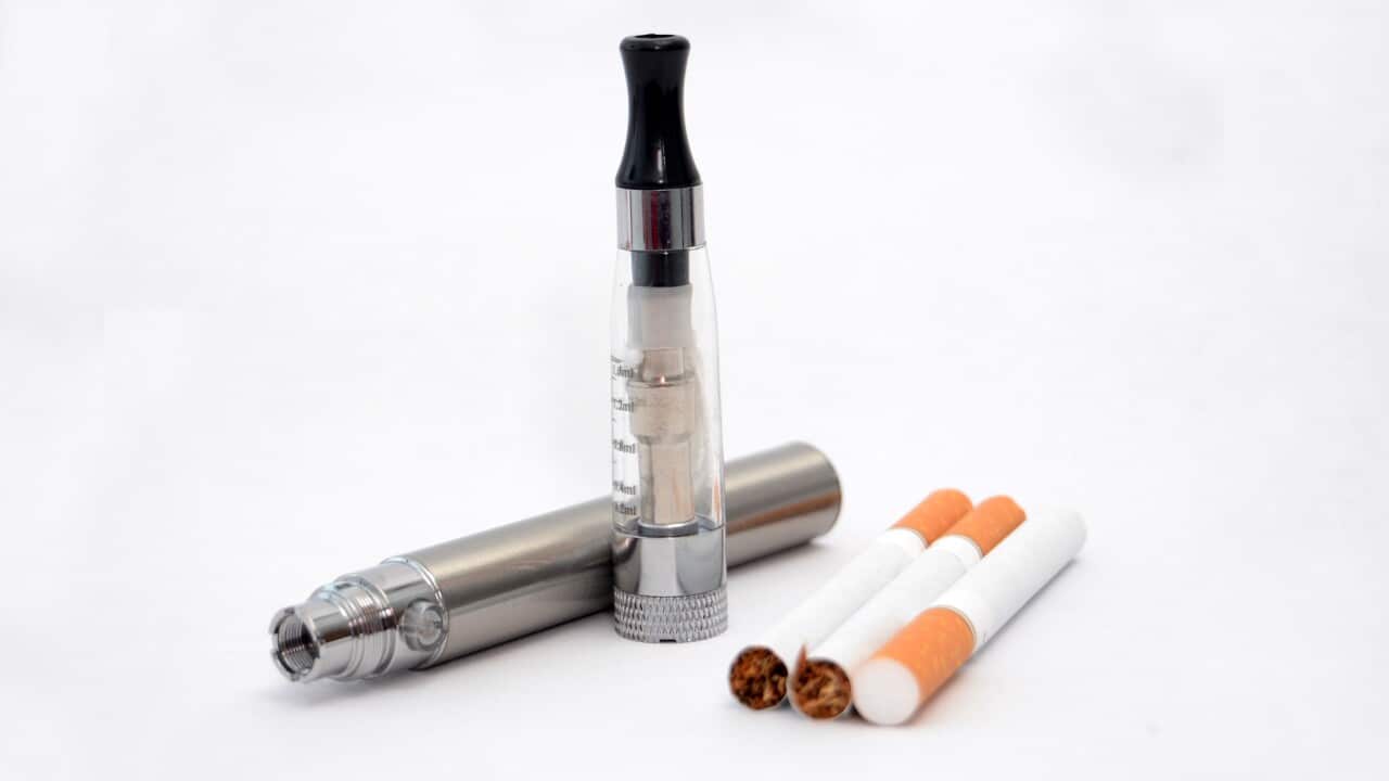 Close-Up Of Cigarettes Over White Background