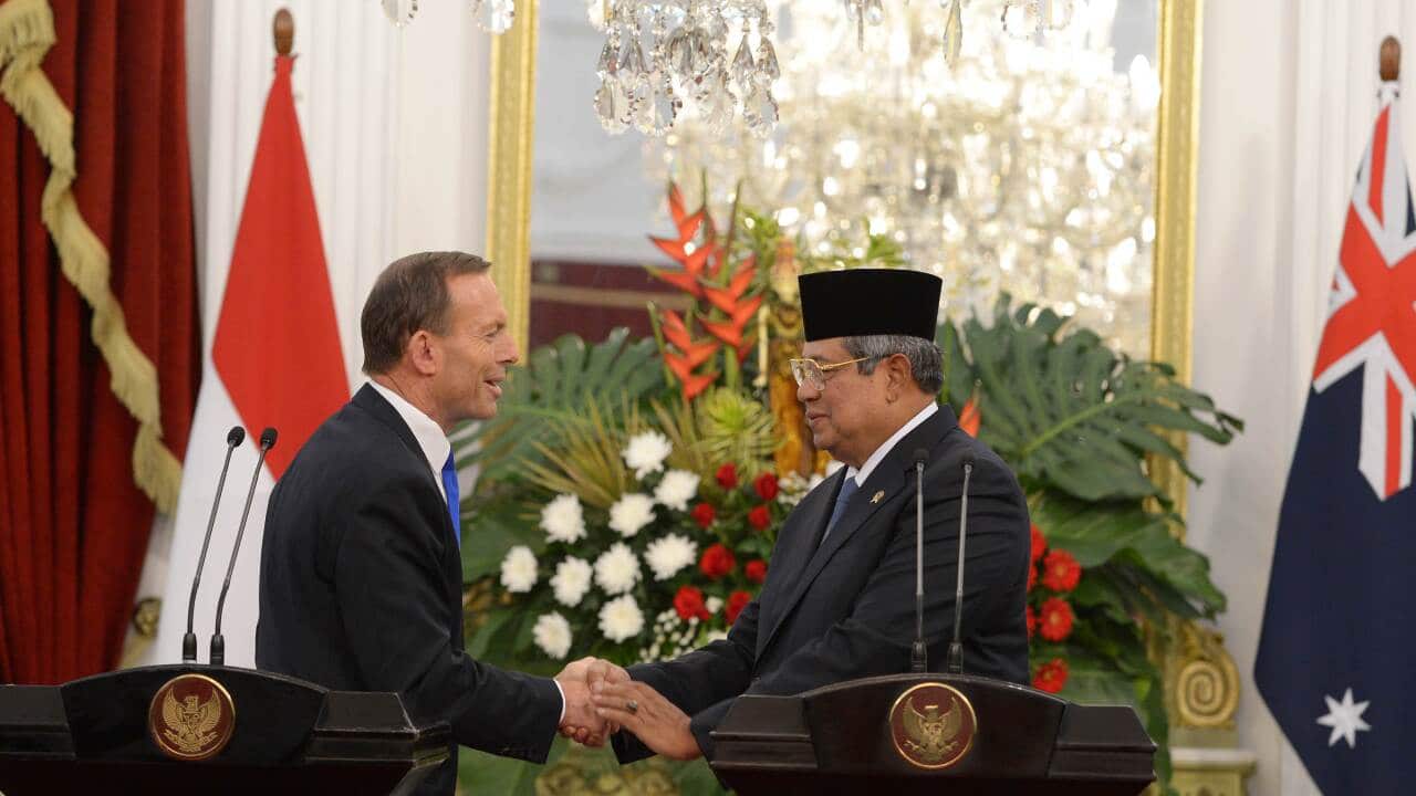 Indonesia's President Susilo Bambang Yudhoyono (R) shakes hands with Australia's Prime Minister Tony Abbott - AAP.jpg