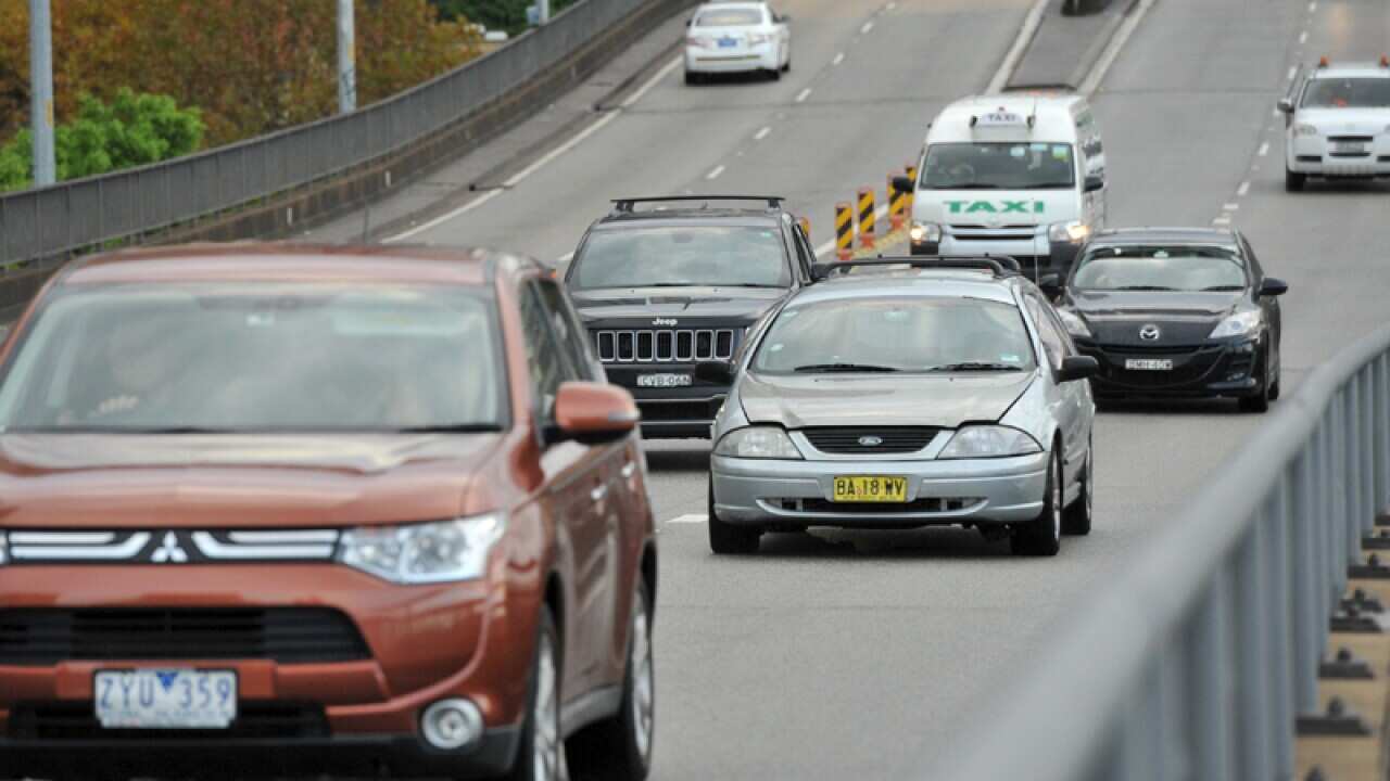 Cars seen on a motorway.