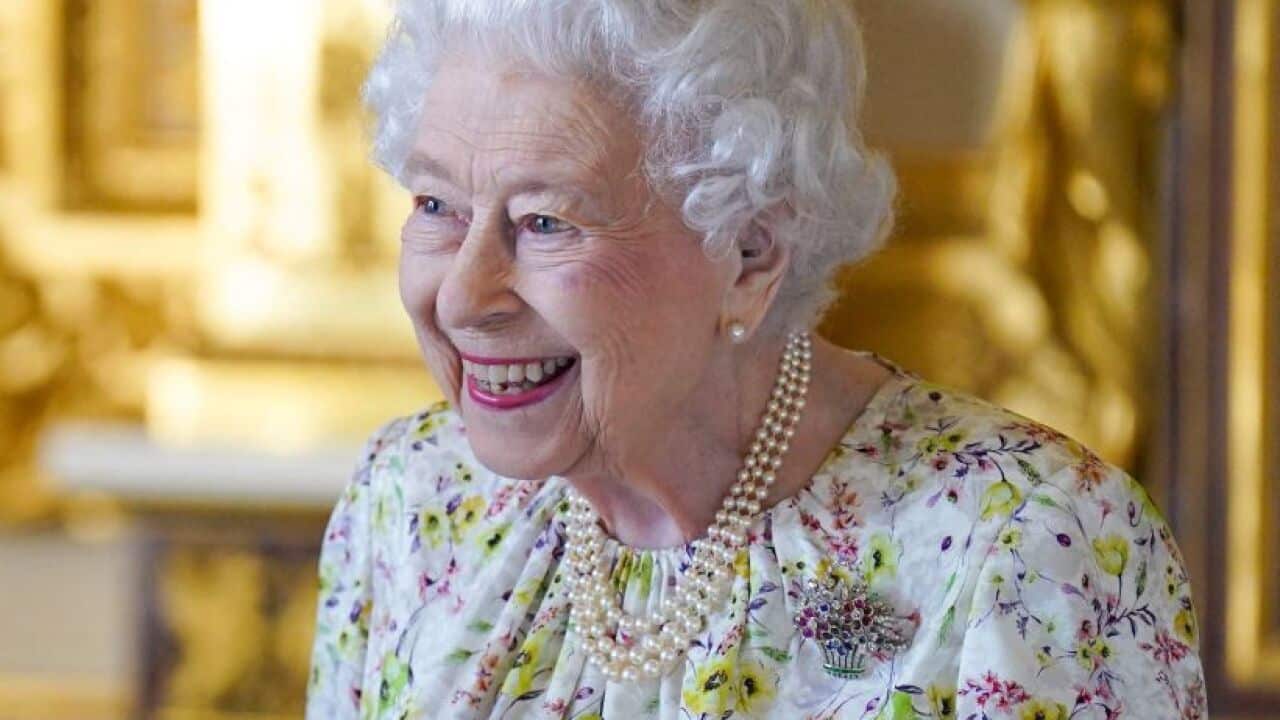 Queen Elizabeth is seen smiling.
