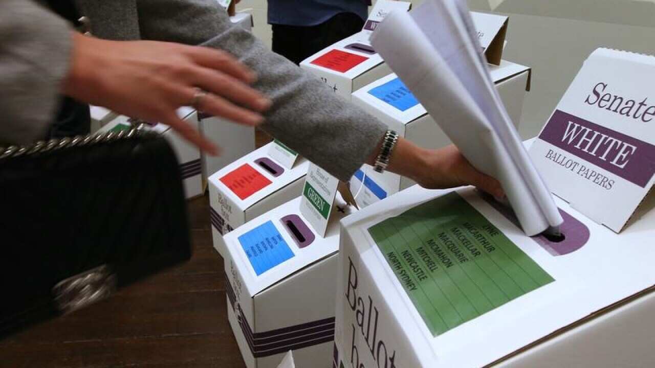 A file image of a voter at a polling station