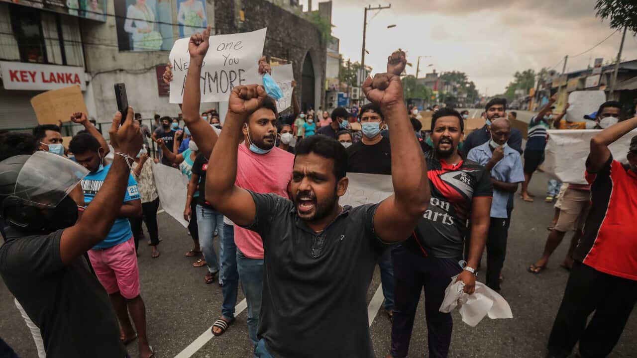 Sri Lankans are seen protesting.