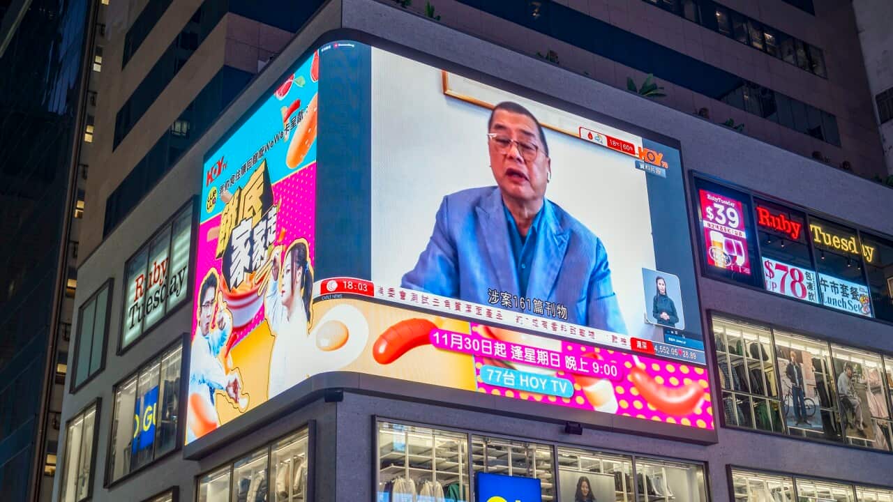 A large neon LED screen showing Hong Kong tycoon Jimmy Lai, who has been found guilty under the national security law, Hong Kong, China.