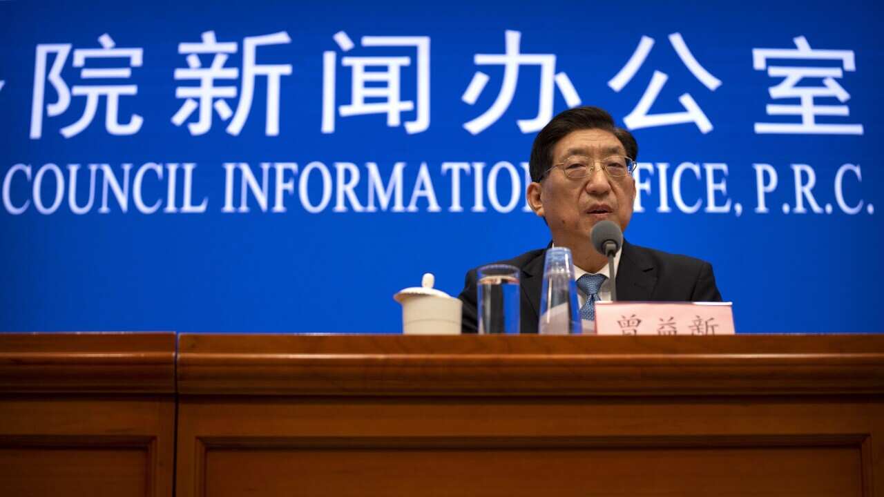 Zeng Yixin, Vice Minister of China's National Health Commission, speaks at a press conference at the State Council Information Office in Beijing