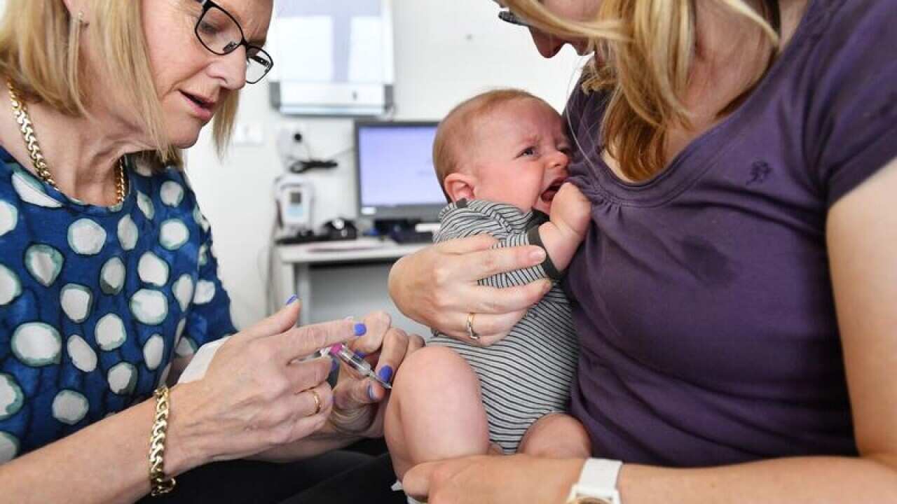 A baby gets an injection
