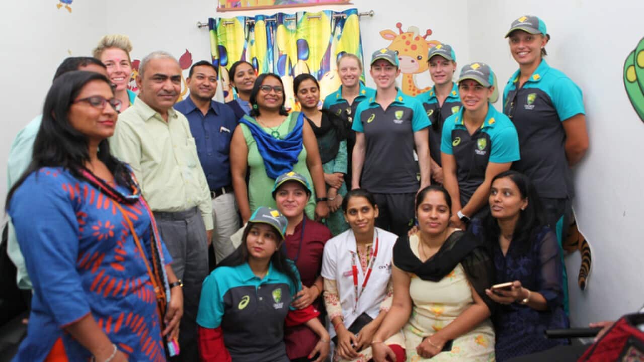 Australian team players are in the group photo with victim of domestic voilence at Kareli Baug Mahila police station.