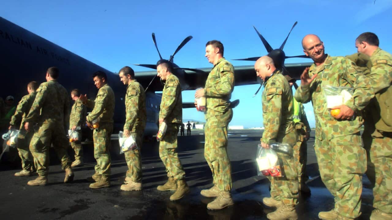 UN peacekeeping forces from Australia board an aircraft